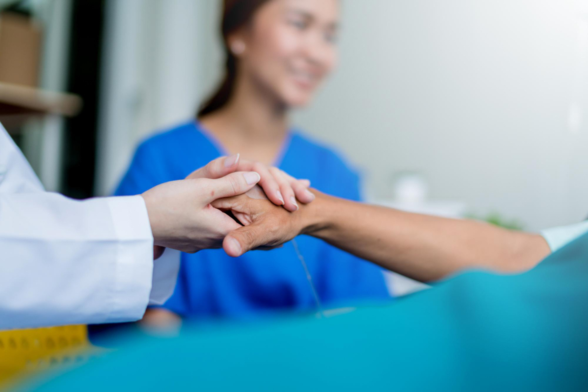 A person holding another person's hand