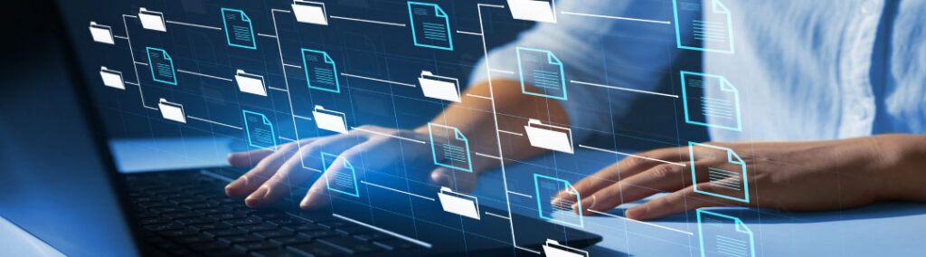 A person on a computer with computer file graphics.