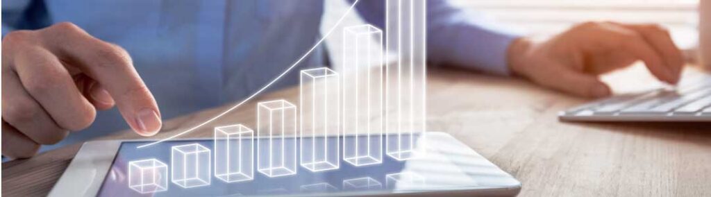 A person pointing at a tablet along with a bar graph illustration