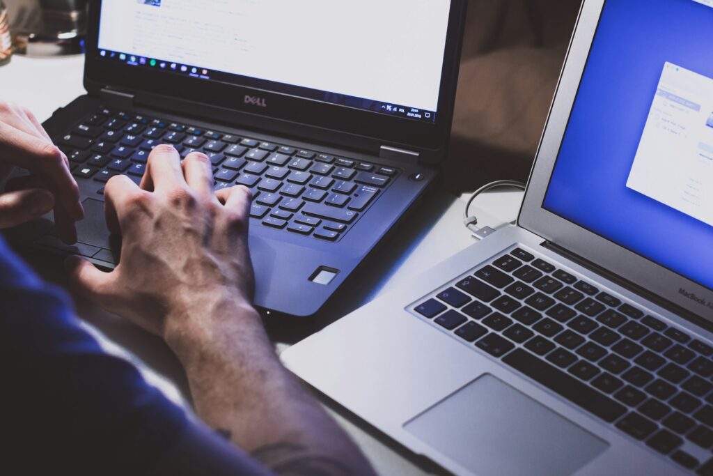 A person with two computers.