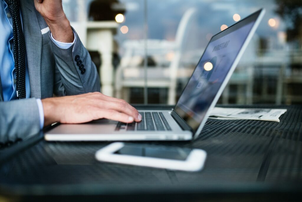 A person using a laptop on a table