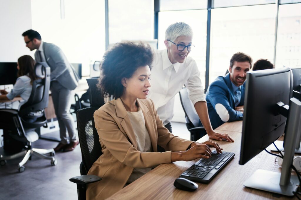 a woman at a computer and communicating