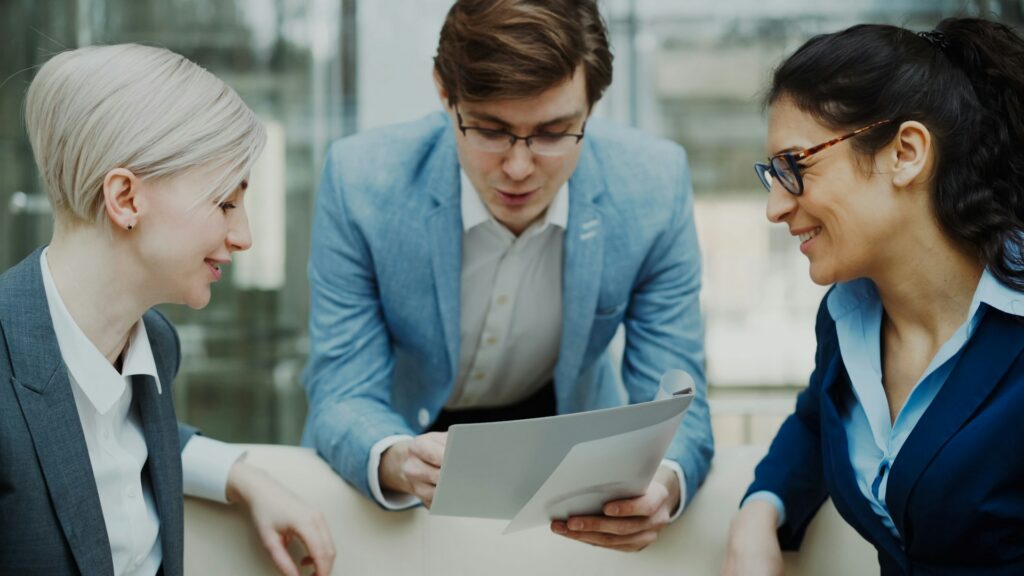 A group of 3 people communicating