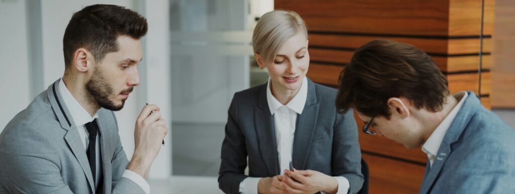 A group of three people communicating