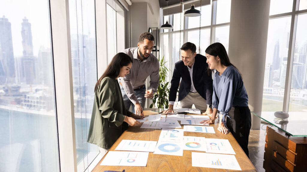 group of people looking at data on a table