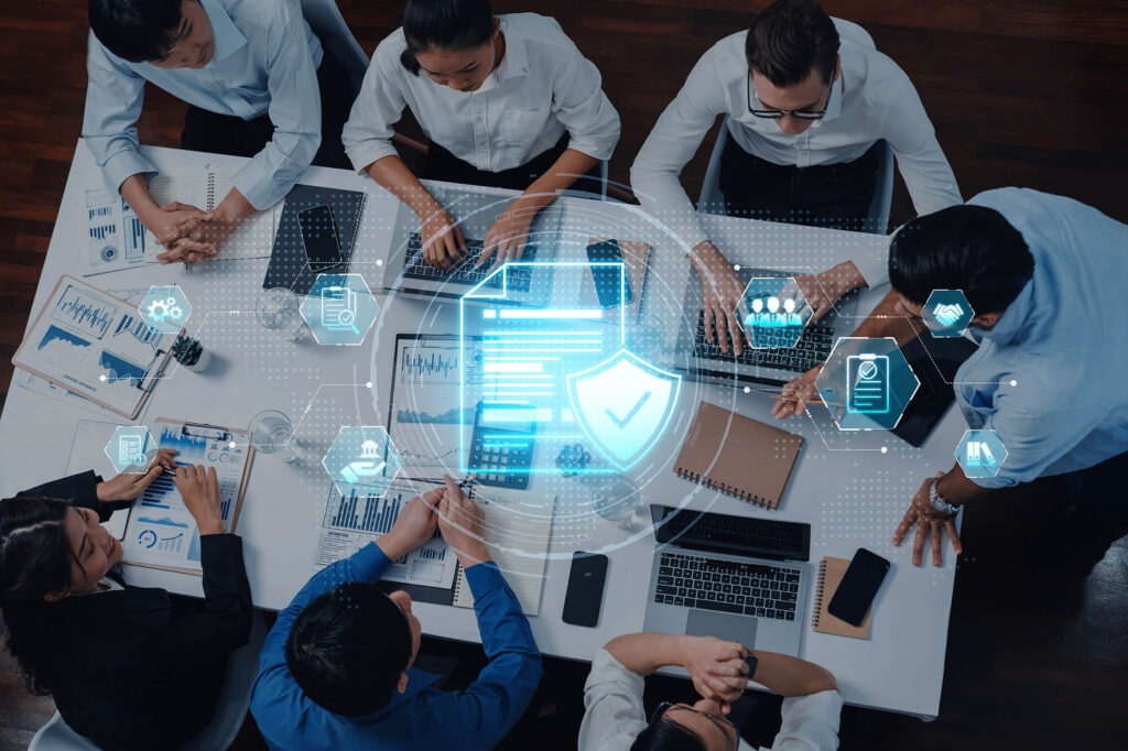 a group of people using computers with technology
