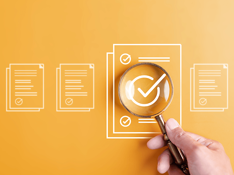 Evaluation graphics with a magnifying glass.